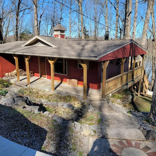 view of home as you arrive. covered porch with wrap around on three sides