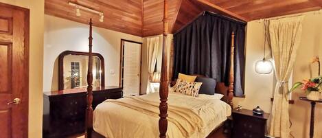 Master bedroom with fire place, balcony, and ensuite bathroom
