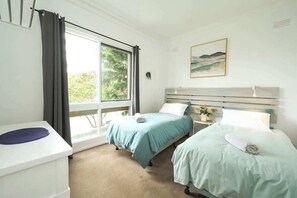 Comfortable #2 bedroom with 2 single beds.