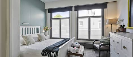 Bright and spacious bedroom with king-size bed