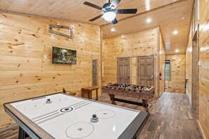 Treat your family to your own private arcade; featuring Packman, Golf, Air Hockey, And Foosball!