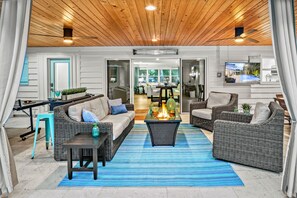 Fire pit Area with patio doors open and looking into home.