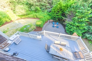 250 sq ft deck overlooking an 1100 sq ft patio w/ firepit.  Private backyard!