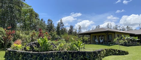 Overall view of Koi fish pond area with Guest House in background.