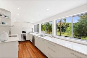 Kitchen with a view out over Martinsville Valley.  Extremely well stocked with 3 microwaves, 3 toasters and cooking pans, pantry and 2 fridges.
