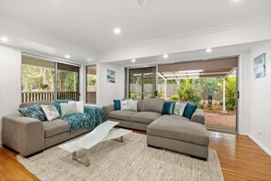 Main loungeroom upstairs.  Art, cushions, attention to detail - come and totally relax.