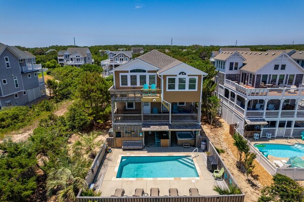 NH285: Beach Brum | Aerial View - Rear Exterior & Pool/Hot Tub Area