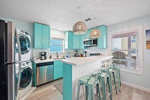 Savor the art of culinary creation in this sleek and modern kitchen, where every detail is designed for culinary delight