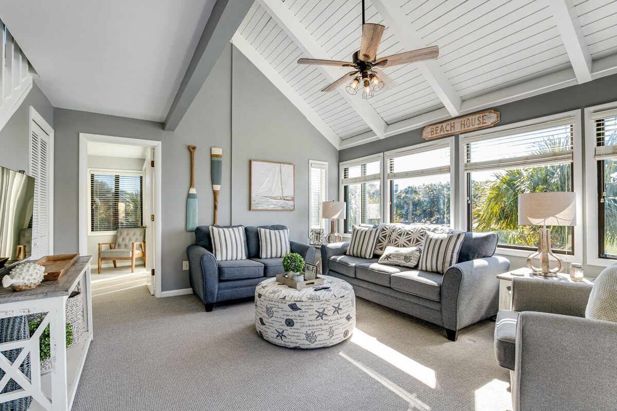 Stylish beach villa with pool, amenities, three decks, and golf course views