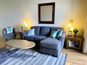 Newly furnished living room with queen size sofa bed 