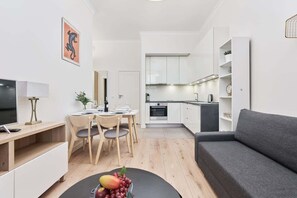 The elegant living room featuring a double sofa bed.