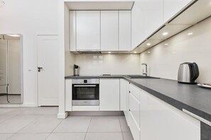 The fully equipped kitchenette includes everything you need for a home-cooked meal.