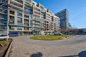 Building exterior showing modern architecture and landscaping.
