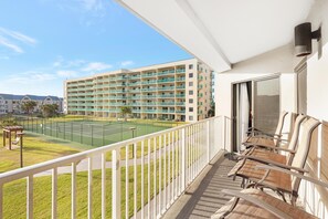 Balcony - This first floor balcony offers a great view of one of the tennis courts offered on site. Gulf Shores Plantation is desired by many guests for the many exceptional amenities they offer.