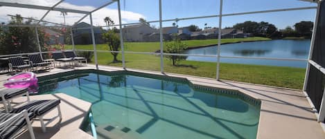 View from pool decking overlooking private lake