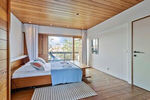 Cozy bedroom with parquet flooring with a warm feel