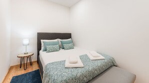 Cozy bedroom with a double size bedroom and cozy linen that will make you feel like you're in the clouds #porto #airbnbporto #portugal #cozy