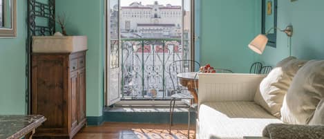 Bright living room with a comfy sofa, with a wonderful view and natural light #airbnb #lisbon #pt #portugal #downtown #livingroom #view #naturallight