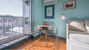 Dining area for 4 people with additional natural light and an amazing view #airbnb #lisbon #pt #portugal #view #diningarea #downtown