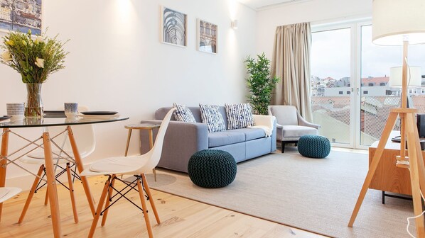 Spacious living room, with a restful sofa and unique decor #airbnb #lisbon #pt #portugal #