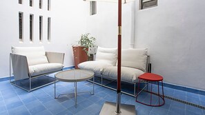 Exterior with two comfortable sofa chairs with a nice parasol #airbnb #lisbon #pt #portugal #balcony