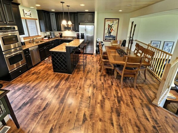 Gourmet Kitchen with Dining Bar and Dining Table