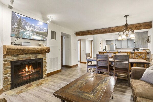 Living Room with Wood Fireplace and 55"Living Room with Wood Fireplace, 55" TV and Bose Bluetooth Stereo SystemTV and Bose Bluetooth Stereo System