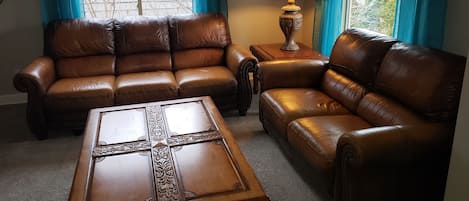 Living room with super comfortable leather sofas.