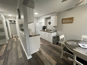 Kitchen entrance and linen closet.