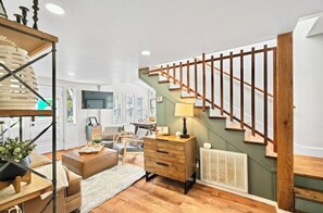 TV on main floor, view going up to 2nd bedroom