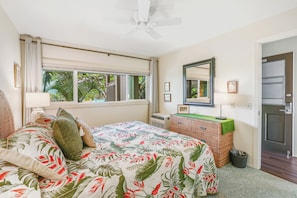 The king-sized bed, with plush pillows and soft linens, ensures a restful night's sleep.