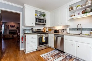 Granite counter tops and a gas grill for cooking!