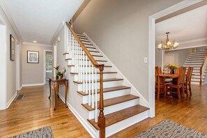 Welcom to the entry hall and stairs leading to the upstairs bedrooms.