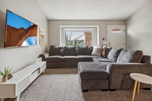 Large open living area with TV