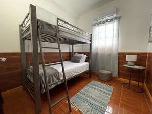 Second bedroom with bunk beds, closet and luggage rack