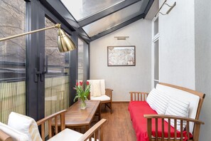 Dining area with a skylight providing natural light and a cozy vibe.
