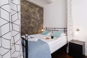 Elegant bedroom featuring a cozy double bed and modern design.
