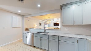 Kitchen Opens to Dining and Living Areas