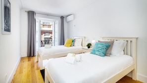 Spacious bedroom with two single beds with AC #downtown #lisbon #airbnb