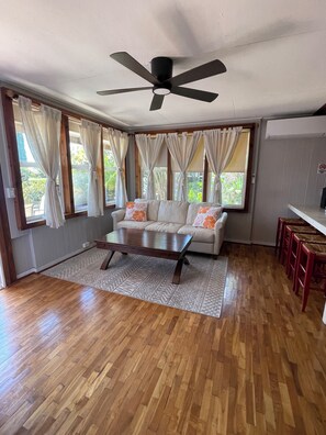 Bright and airy living room with split A/C and 60-inch Smart TV!