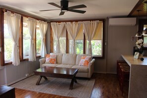 Bright and airy living room with split A/C and 60-inch Smart TV!