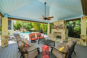 Pool cabana with fireplace and TV above (not shown- older picture)