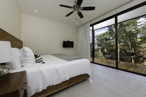 Master bedroom with sliding glass doors to the balcony.