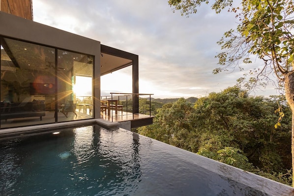 Sunset over your private infinity edge pool.
