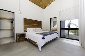 Master bedroom with luxurious king size bed.