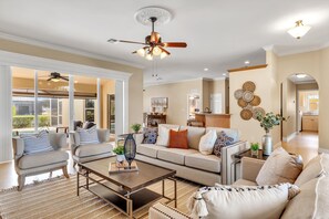 Spacious and airy—enjoy seamless flow between the living room and kitchen! 
