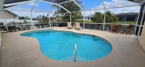 Enjoy the warmth of a heated saltwater pool surrounded by lush Florida scenery!