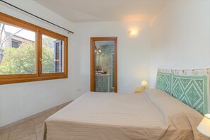Bedroom with own bathroom with showewr