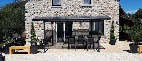 Pool, pergola, and poolside seating of Casa Nora Adriatica.