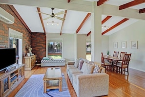 Large open living room, with 8 seater dining